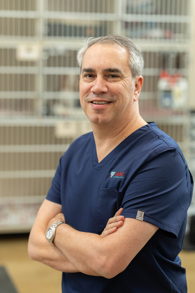 Emergency Vet in Norman OK veterinarian standing confidently inside the animal emergency hospital